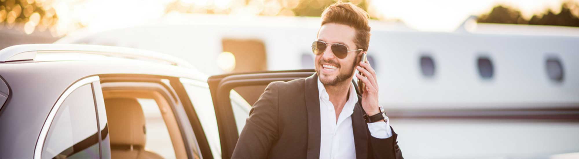 Private-jet-man-on-phone-booking-transfer-200×550